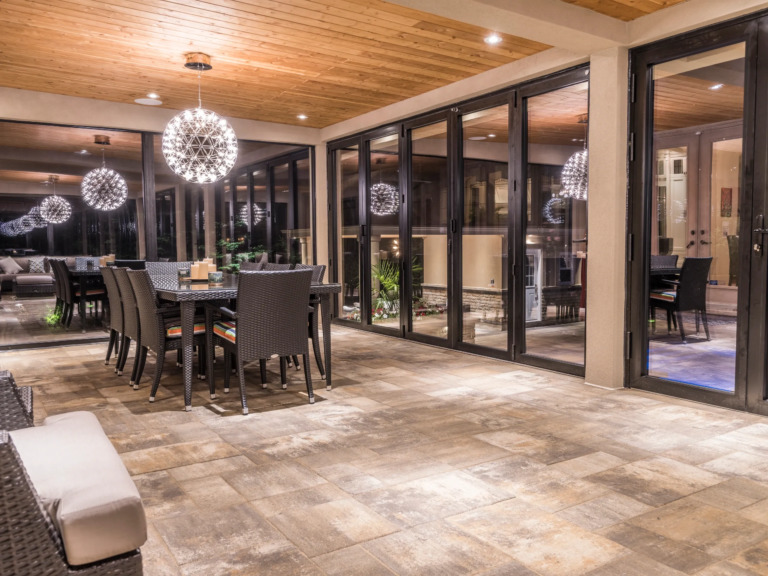 Outdoor kitchen and dining area on multi-level deck