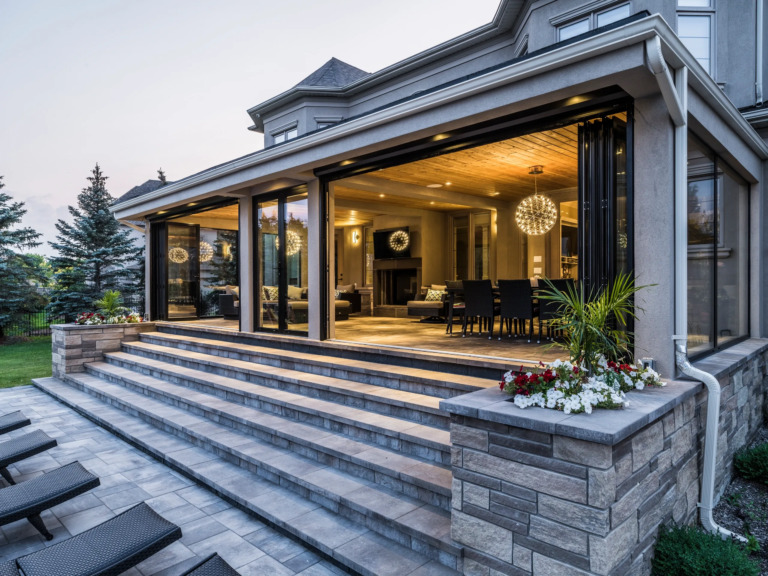 Multi-level deck overlooking landscaped yard at Four Seasons Estate