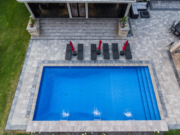 Modern outdoor dining area on deck at Four Seasons Estate