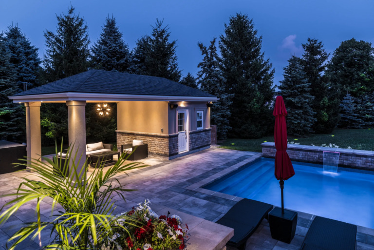 Large patio area with stone tiles and outdoor furniture
