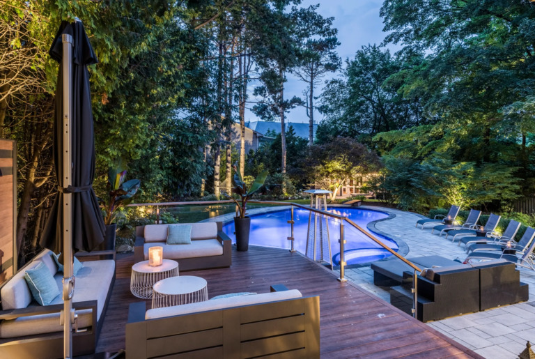 Exterior of a modern villa at dusk, with 1980s-inspired design.