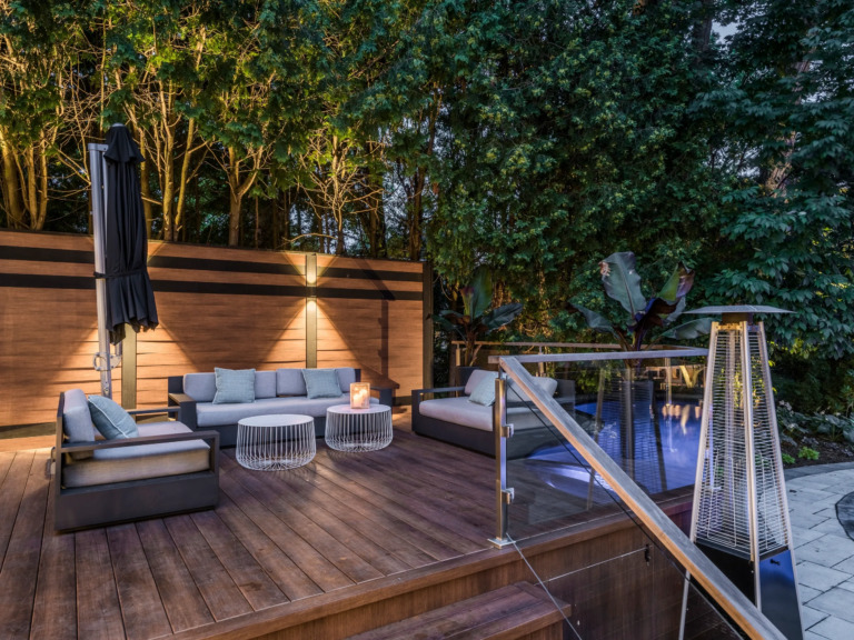 Modern villa with a pool and patio, featuring 1980s architectural style.