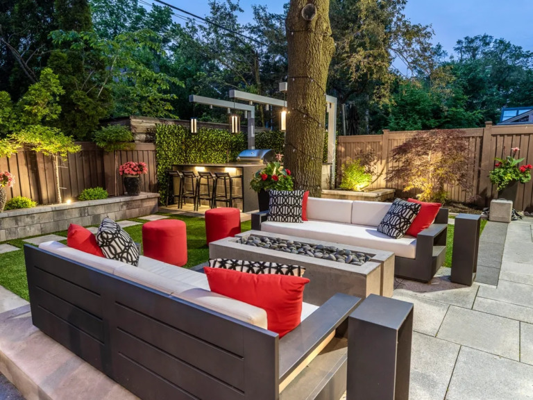 Well-maintained outdoor garden with modern stone work and greenery.