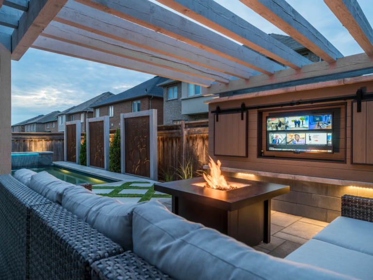 Well-designed backyard space with a pool, garden, and seating area.