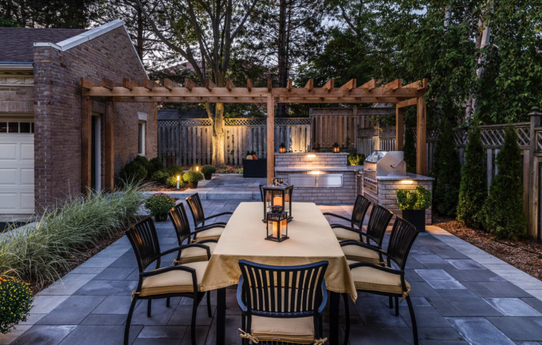 Modern backyard design featuring a rectangular pool and elegant outdoor living space.