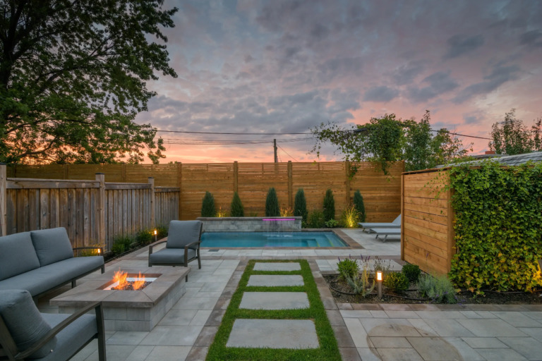 Pathway leading to a pool with a picturesque setting.