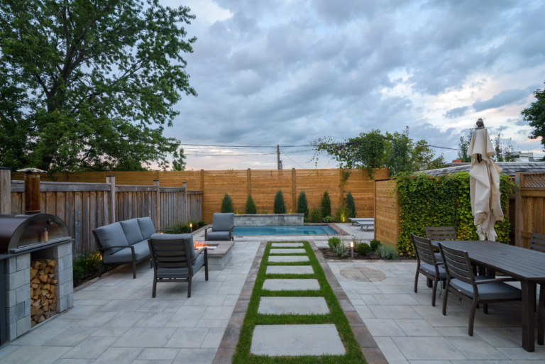 Pathway to the pool, displaying a well-kept landscape.