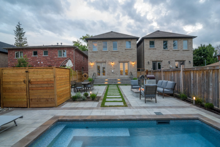 Pathway to the pool, with a focus on surrounding greenery.