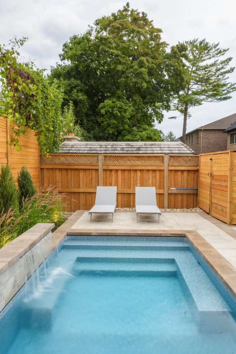 Pathway leading to a pool, with well-planned garden design.
