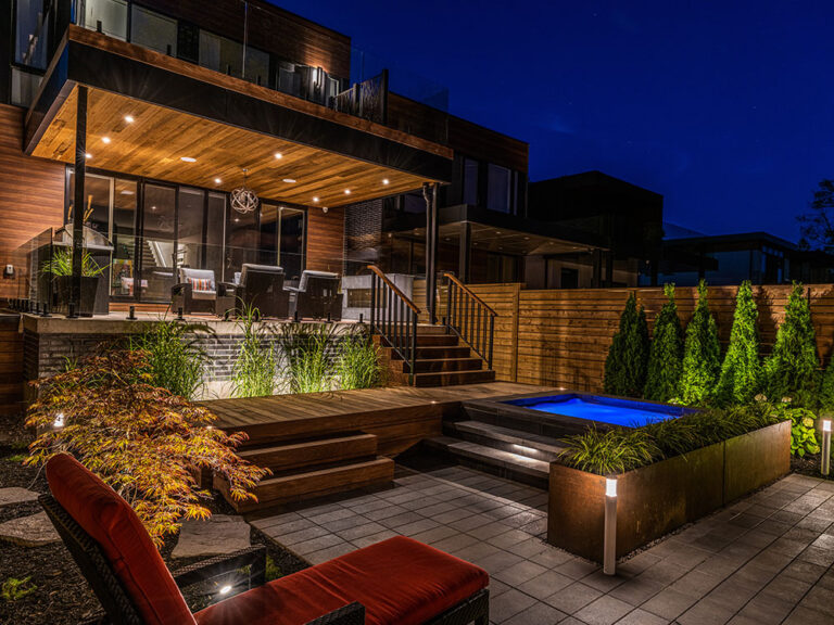 Elegant backyard with contemporary pool and outdoor living space.