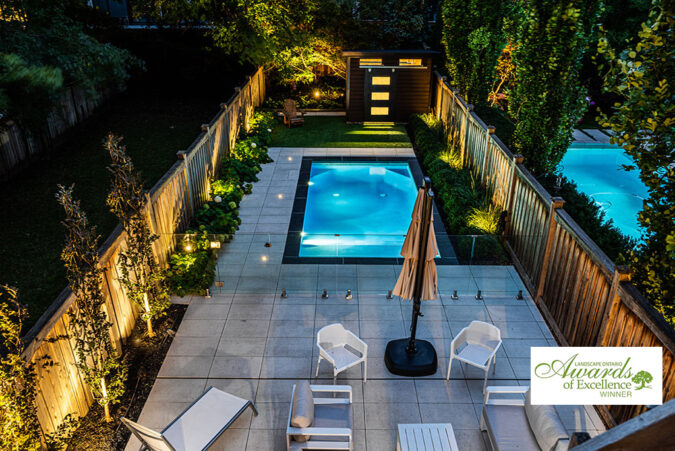 Thumbnail image of a landscaped residential backyard with a pool and seating area.