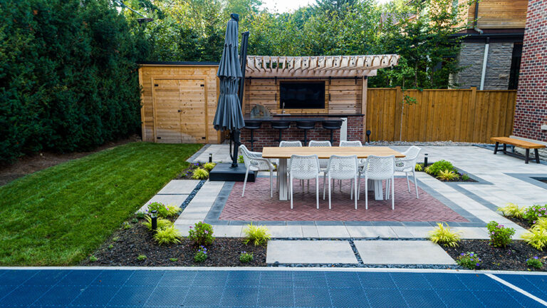 High-angle view of a modern pool and landscaped backyard.
