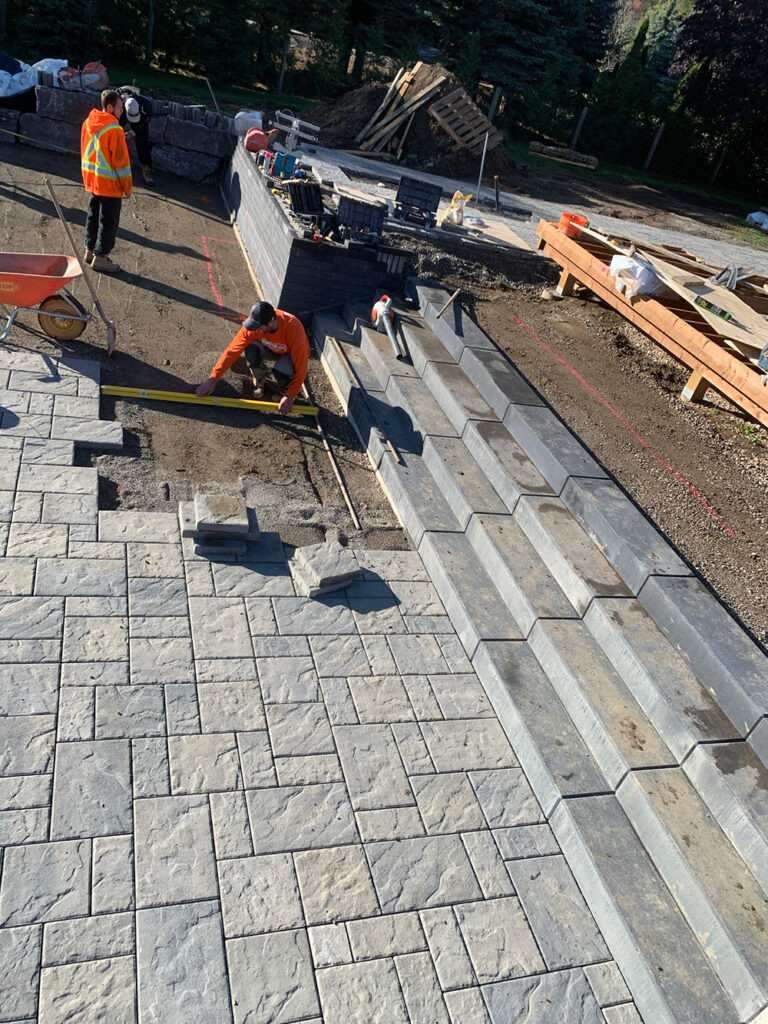 Contemporary outdoor design featuring a clean pool and comfortable seating area.