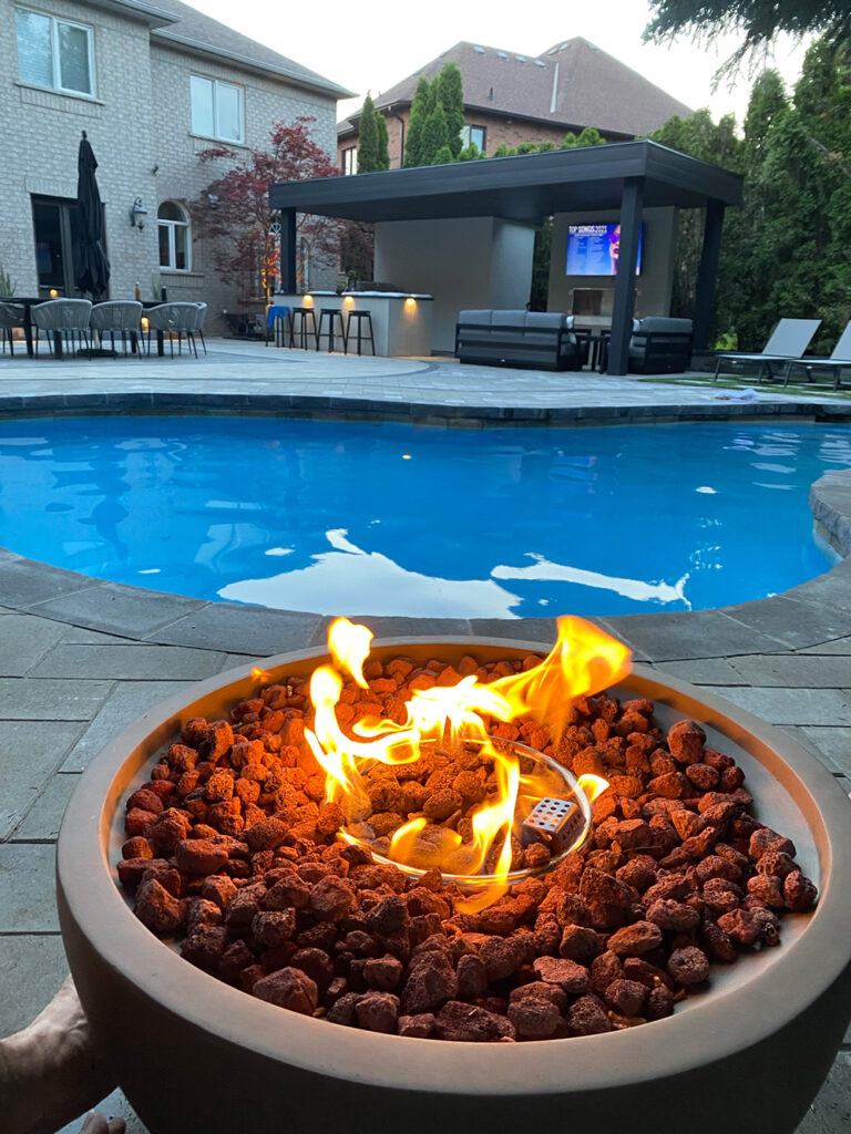 Stunning backyard design featuring a pool and sleek outdoor seating.