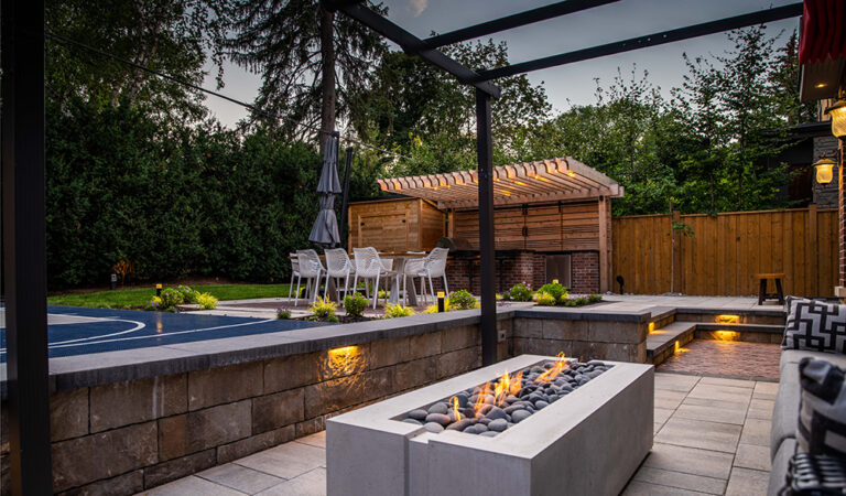 Well-designed outdoor living space with a pool and sleek, modern landscaping.