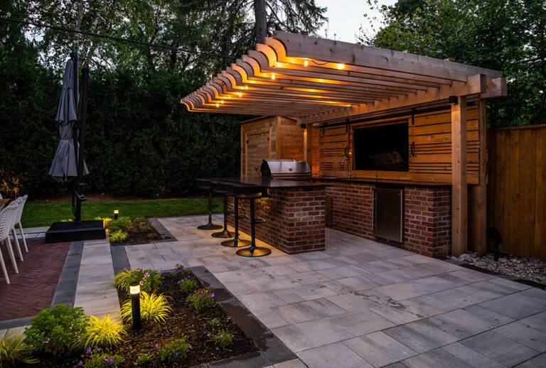 Outdoor lounge area with a pool and well-designed landscaping.
