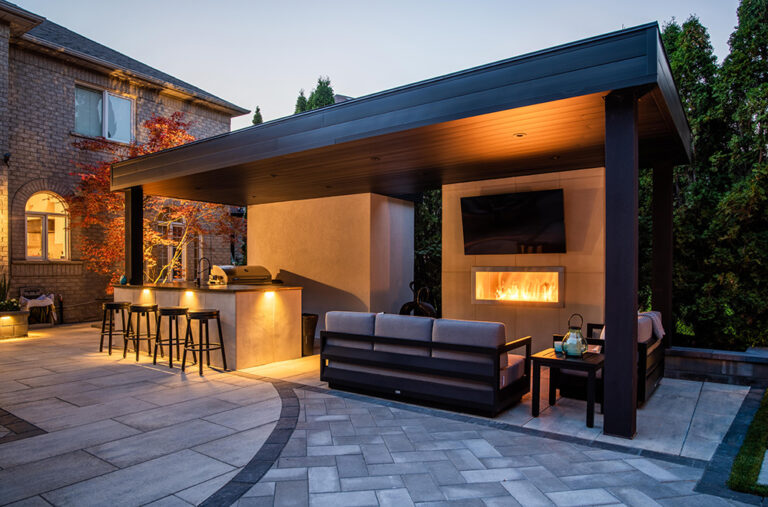 Outdoor seating area with a cozy firepit in a landscaped backyard.