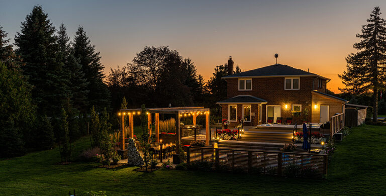 Modern outdoor poolside seating area with comfortable loungers and sleek design.