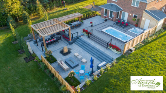 Elegant backyard landscape design with modern pool and greenery.