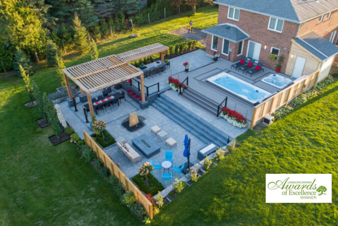 Elegant backyard landscape design with modern pool and greenery.