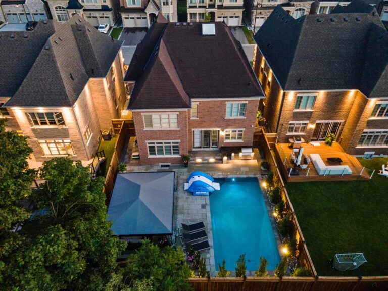 Spacious backyard with multiple seating areas and greenery