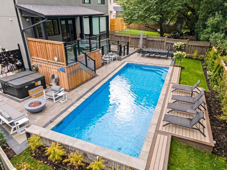 Backyard with a wooden deck and comfortable outdoor furniture