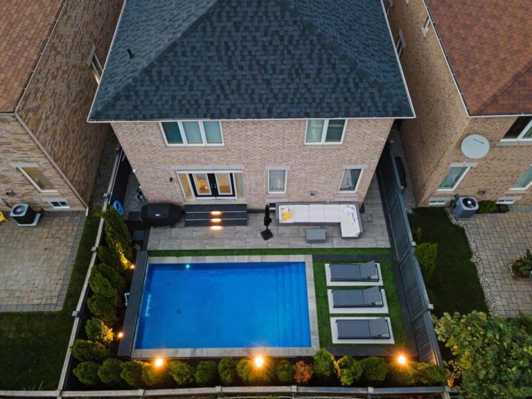 Luxurious backyard featuring a pool and stone patio