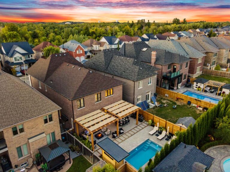 Beautifully landscaped backyard with lush green lawn