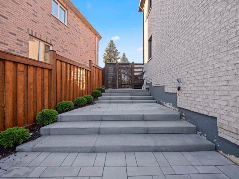 Contemporary backyard with a wooden deck and garden