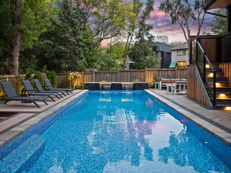 Chic backyard with a pergola and stone paving