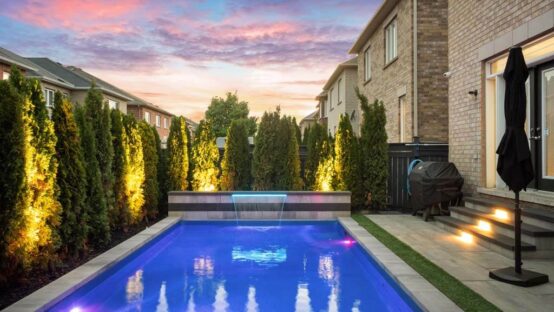 Spacious backyard with a lawn and paved walkway