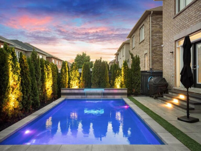 Spacious backyard with a lawn and paved walkway