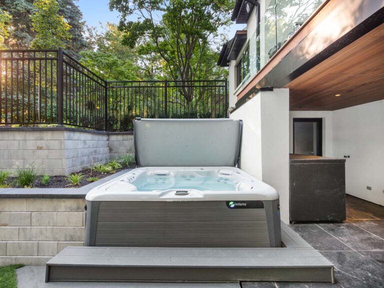 Stylish outdoor kitchen area with a built-in grill and bar seating