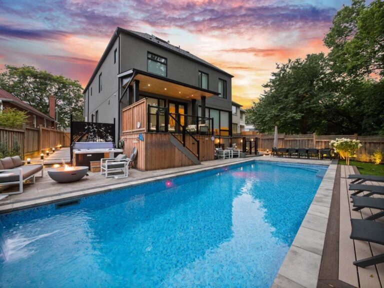 Contemporary backyard with a mix of lawn and hardscaping