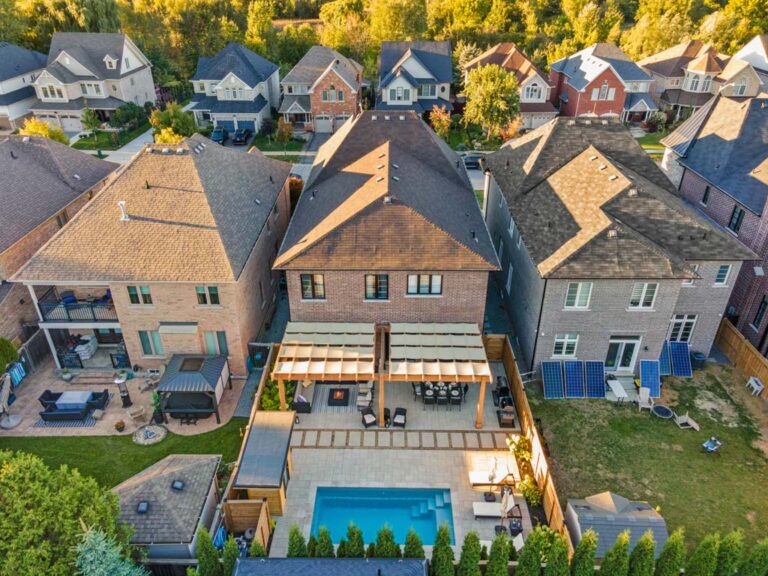 Stylish backyard patio with seating area and greenery