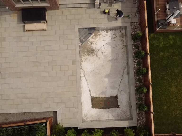 Contemporary backyard with stone paving and greenery