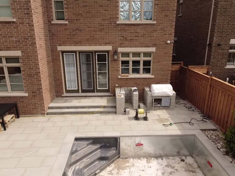 Elegant backyard garden with a water feature and seating