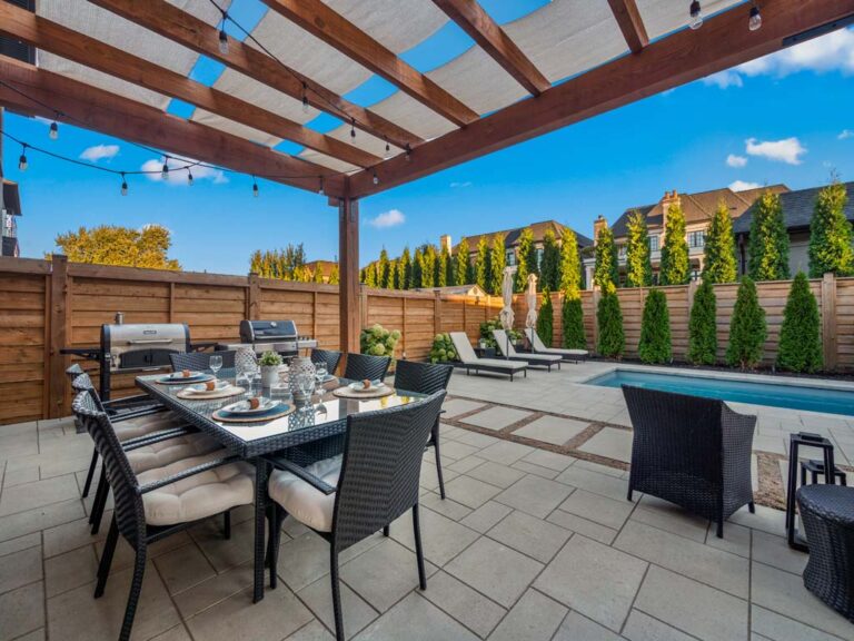 Spacious backyard with modern outdoor furniture and landscaping