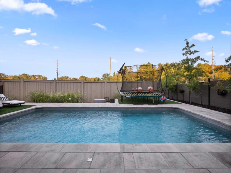 Elegant backyard with stone walkway and plants