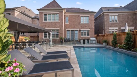 Modern backyard design with outdoor seating and landscaping