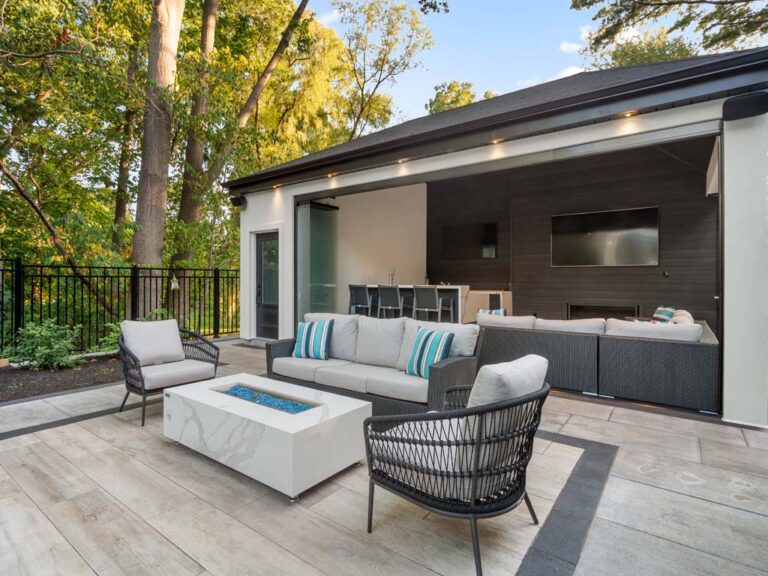 Modern backyard with sleek wooden decking and comfortable lounge chairs