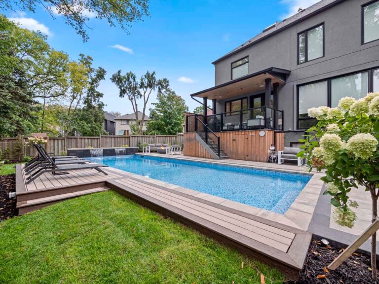 Modern backyard with a wooden deck and outdoor seating