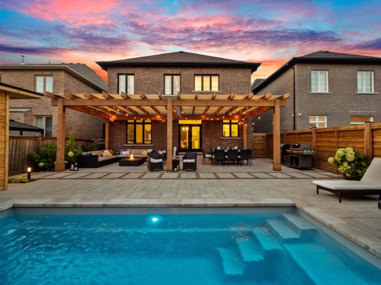 Elegant outdoor space with a fire pit and lounge chairs