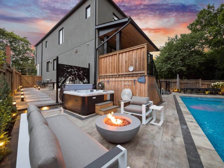 Backyard with a mix of paving stones and lush greenery