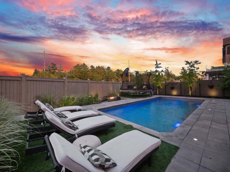 Modern backyard with stone patio and greenery