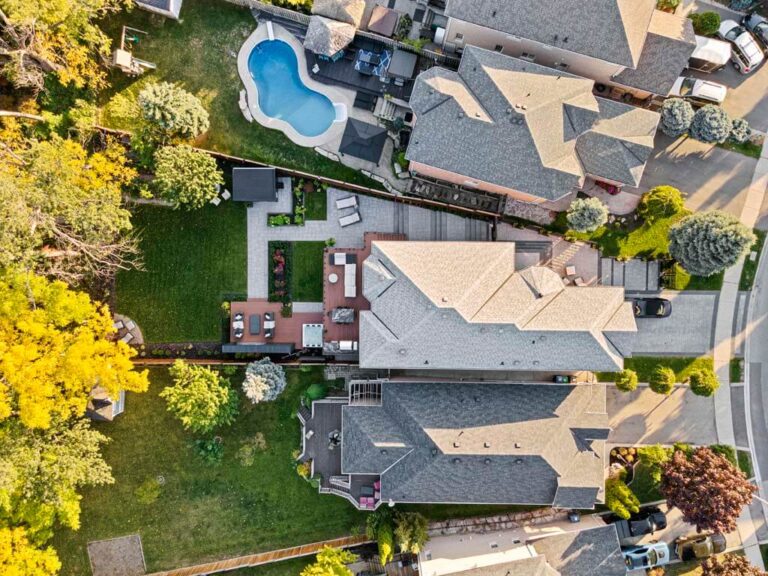 Backyard with a mix of paving stones and grassy areas