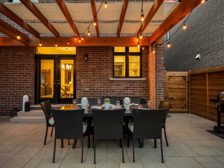 Contemporary backyard design with stone pathways and greenery