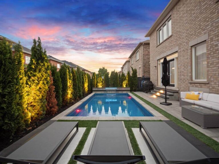 Elegant backyard patio with seating and a garden view