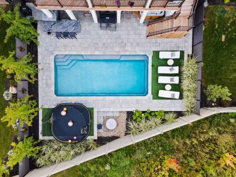 Backyard with stone pathway and greenery