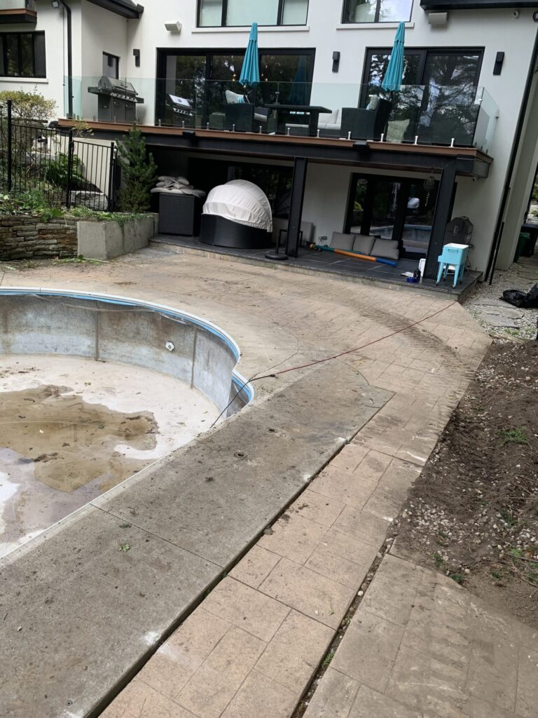 Luxurious backyard with a large pool and surrounding greenery